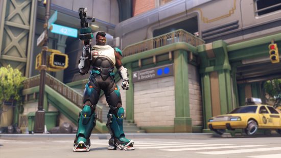 Overwatch 2 characters: a man wearing a tactical military style suit holds a large autmatic weapon