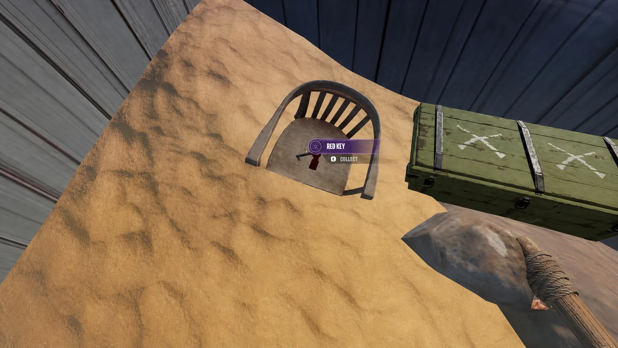 The Red Key on a sand-buried chair inside the Meersauge room