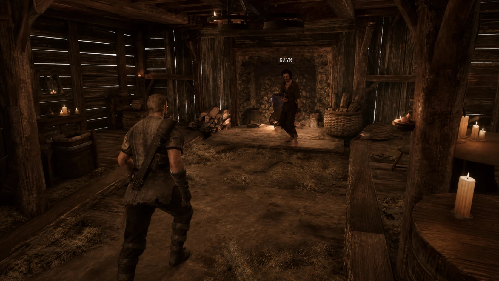 Rayk standing near the cauldron inside the tavern