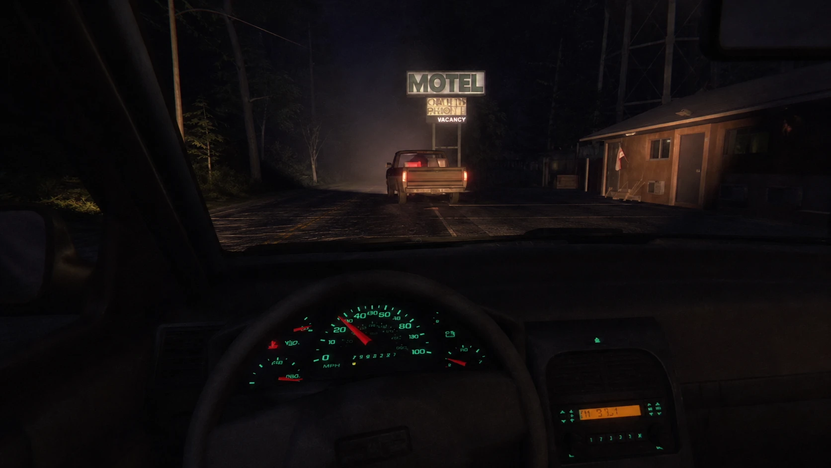 Driving in F2F Scratch Creek with truck and motel sign up ahead