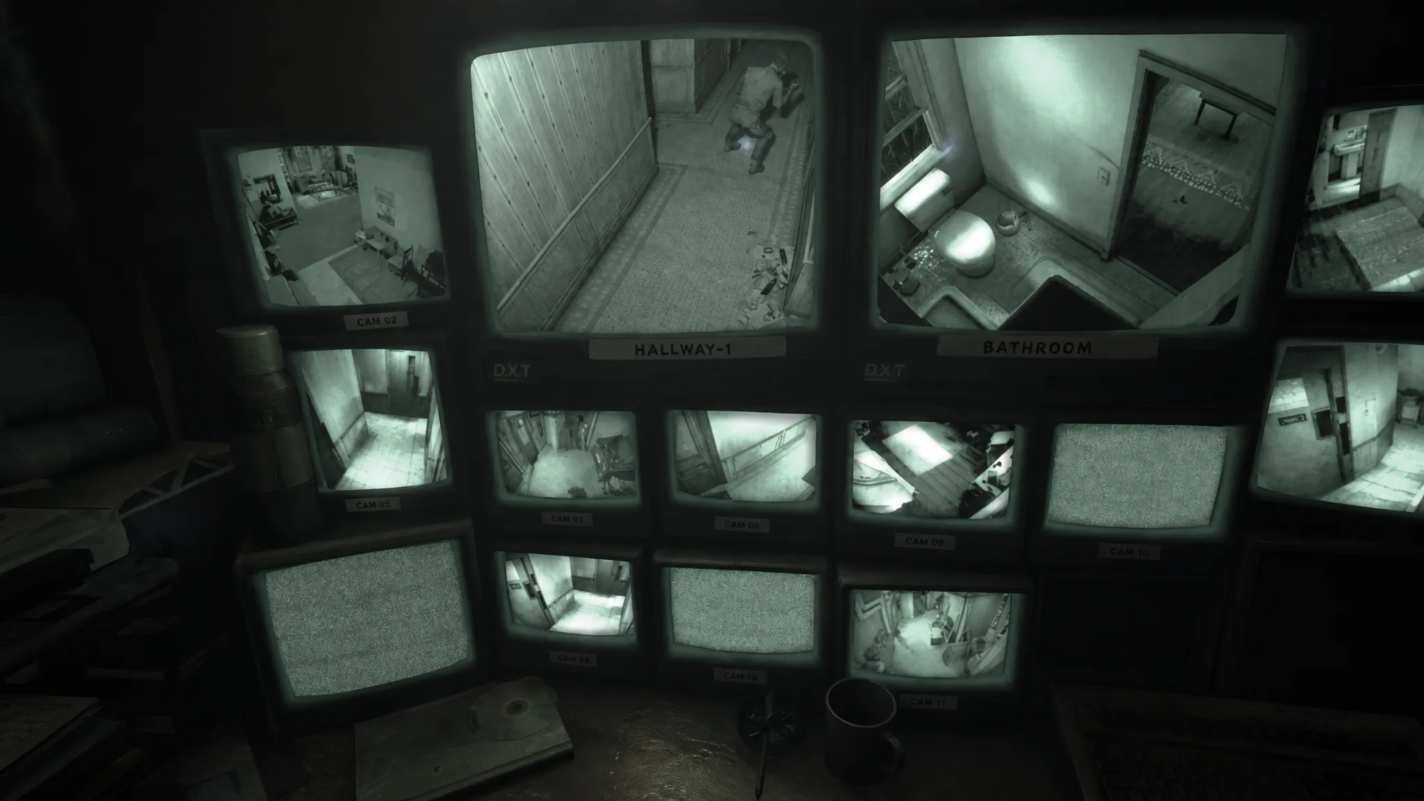 Camera monitors in basement showing flat hallways and interior of Ava's apartment