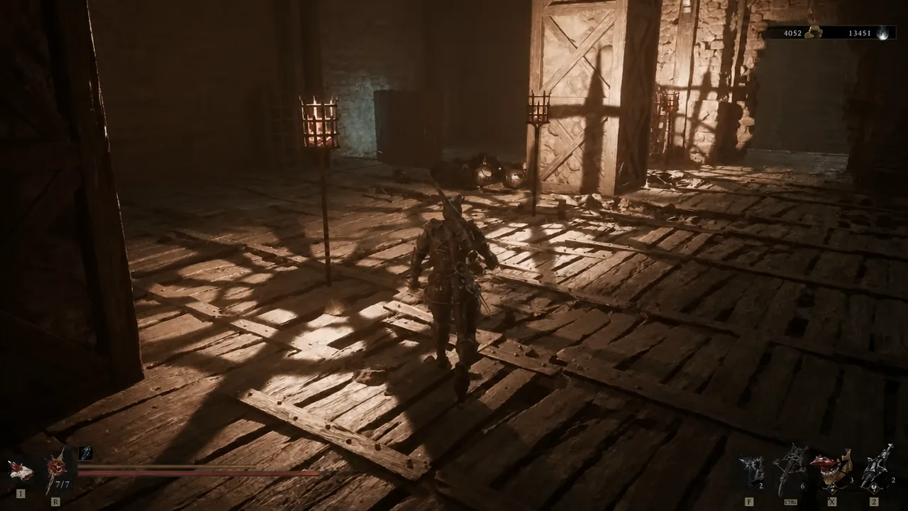 Player moving through the torch-lit wooden interior of the scaffold structure