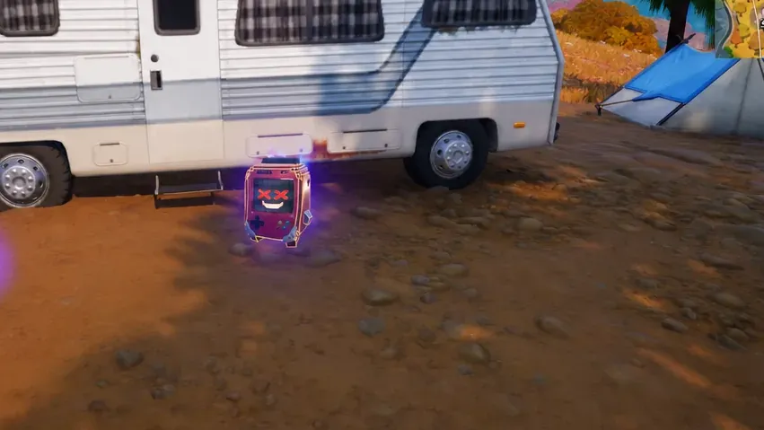 The 8-Bit Sprite sitting on the ground next to a camper before pickup