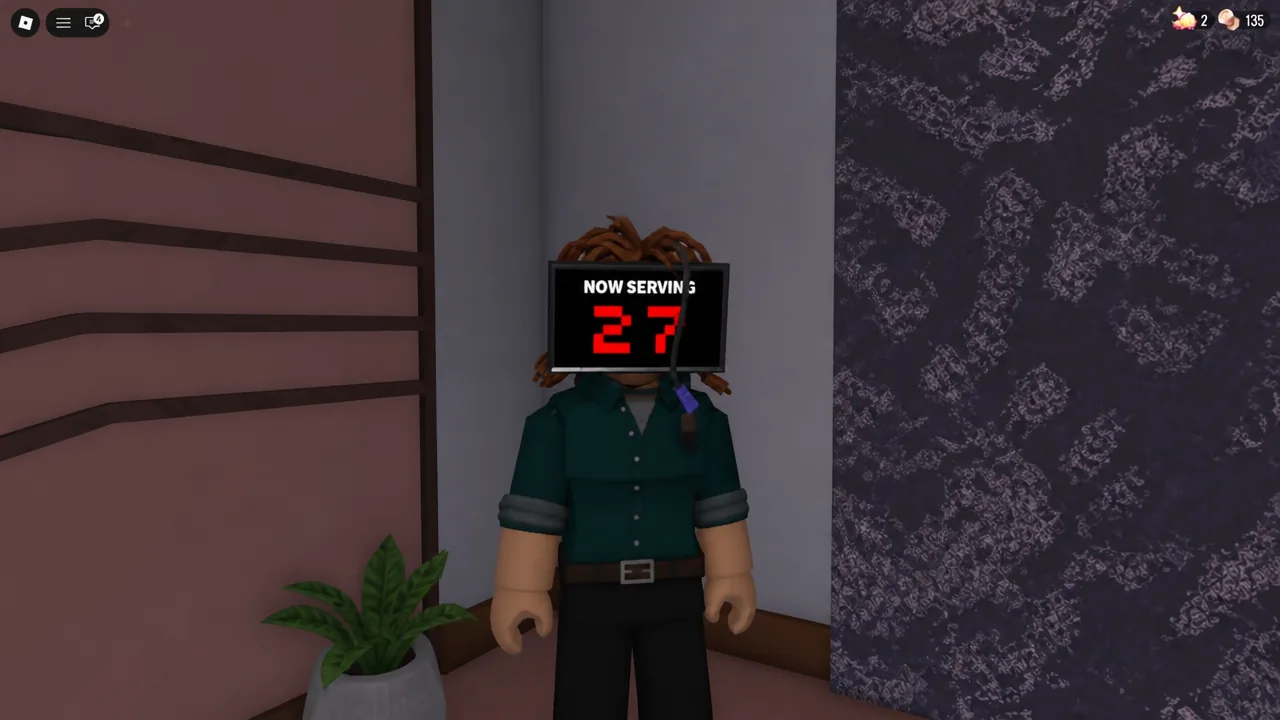 A NOW SERVING display reading number 27 during the Teller encounter