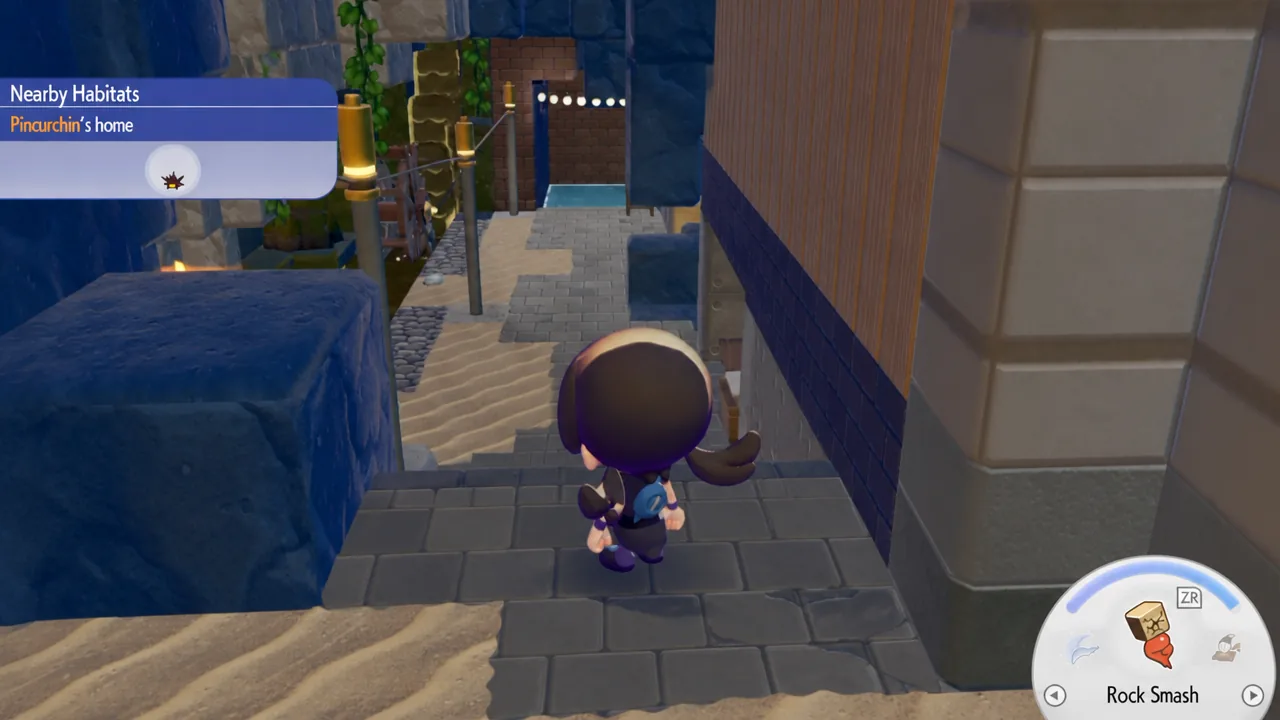 The stairs to the left of the Pokémon Center in Bubbly Basin in Pokémon Pokopia