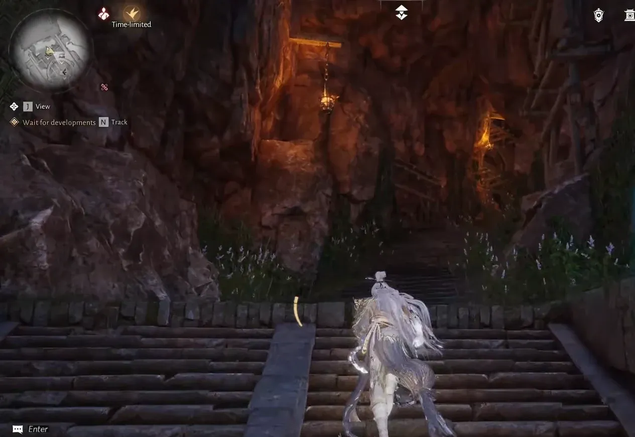 Character climbing temple steps toward the bridge on the way to the first chest