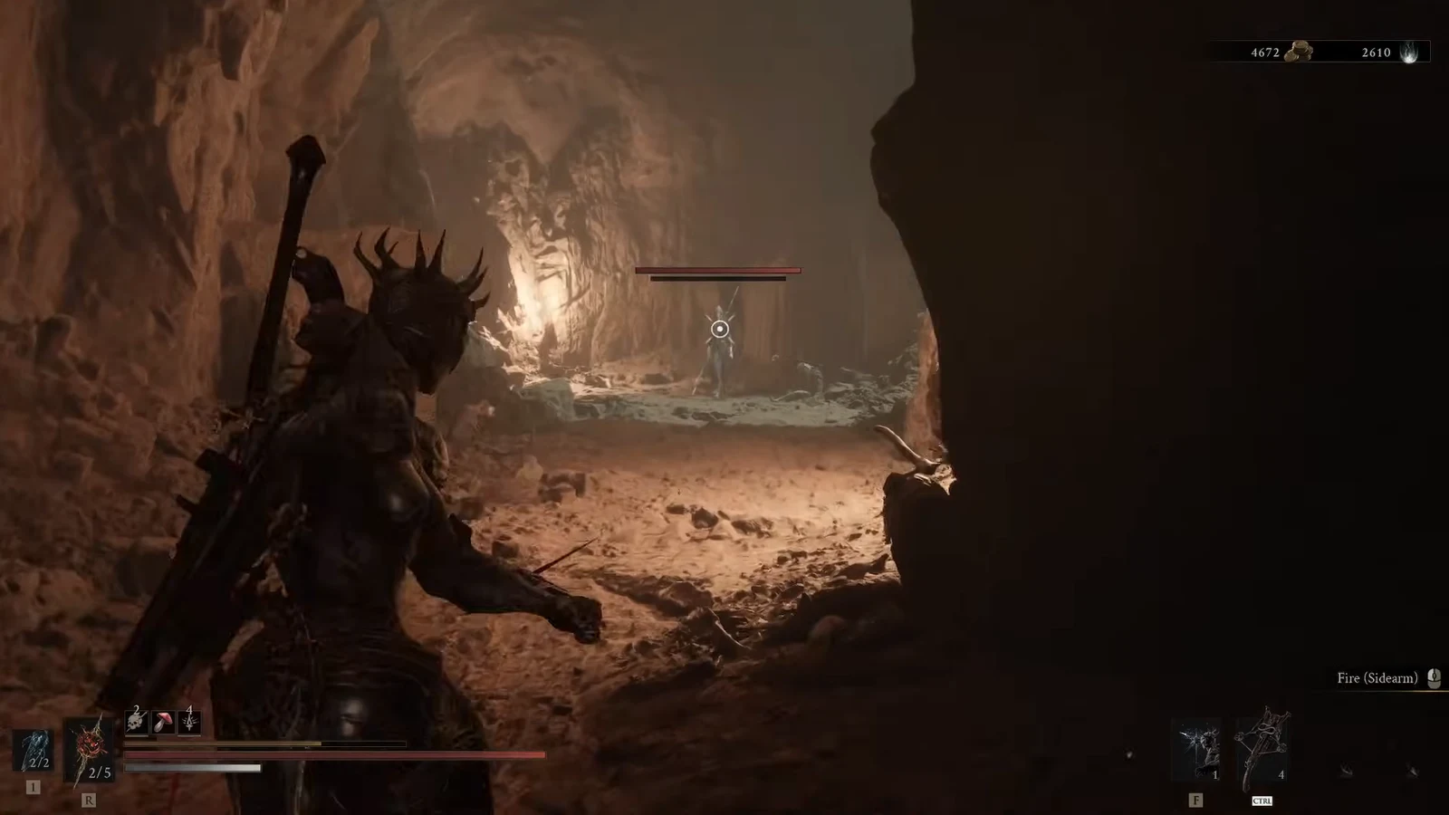 Crosshair aimed at a ranged enemy in the cave with the Fire sidearm selected