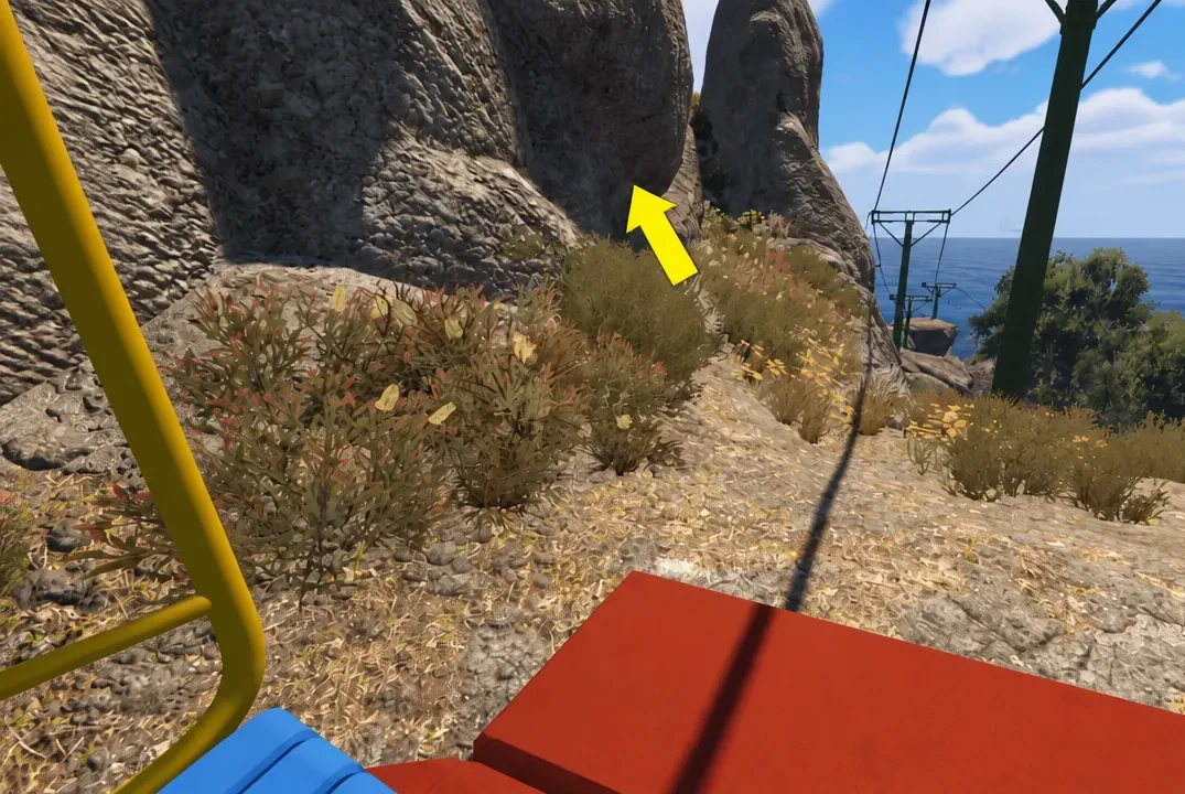 Directional arrow pointing toward the rocky path after leaving the chairlift