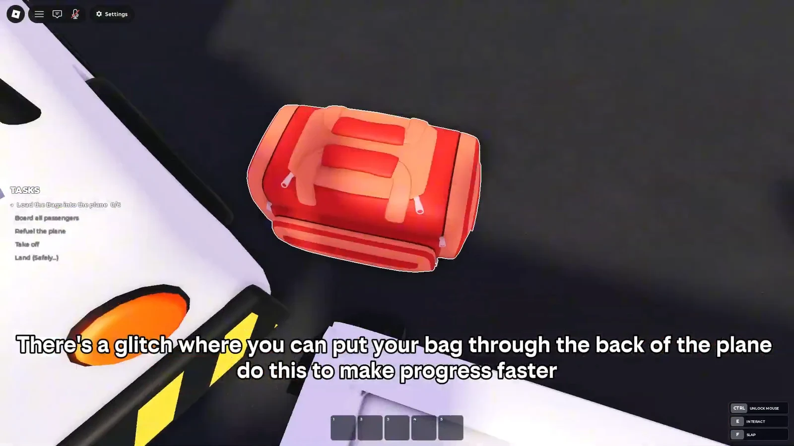 A red bag pushed through the rear of the plane while the luggage loading task is active