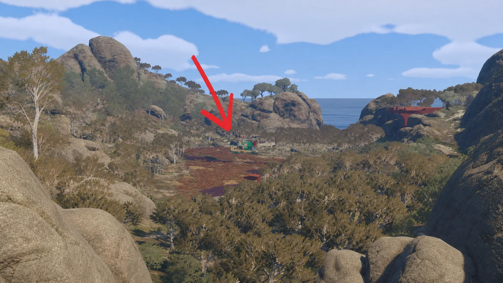 An orange arrow pointing to the location of the Salon to customize your appearance in Big Walk, amid a view of the outback area outside the starting hub