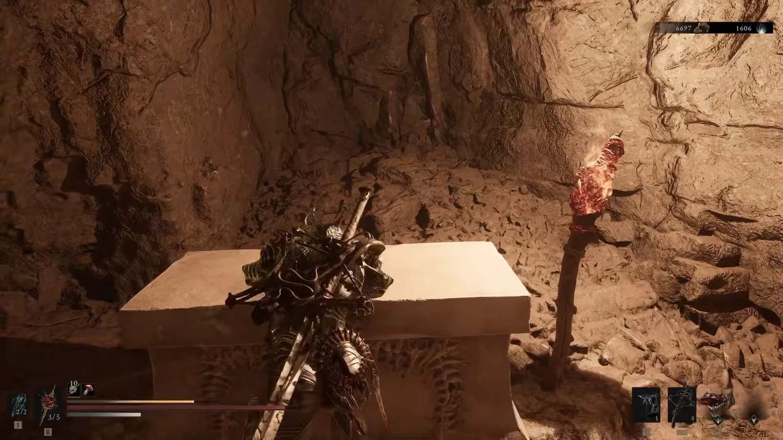 Player character standing beside a stone sarcophagus in a torchlit cave chamber