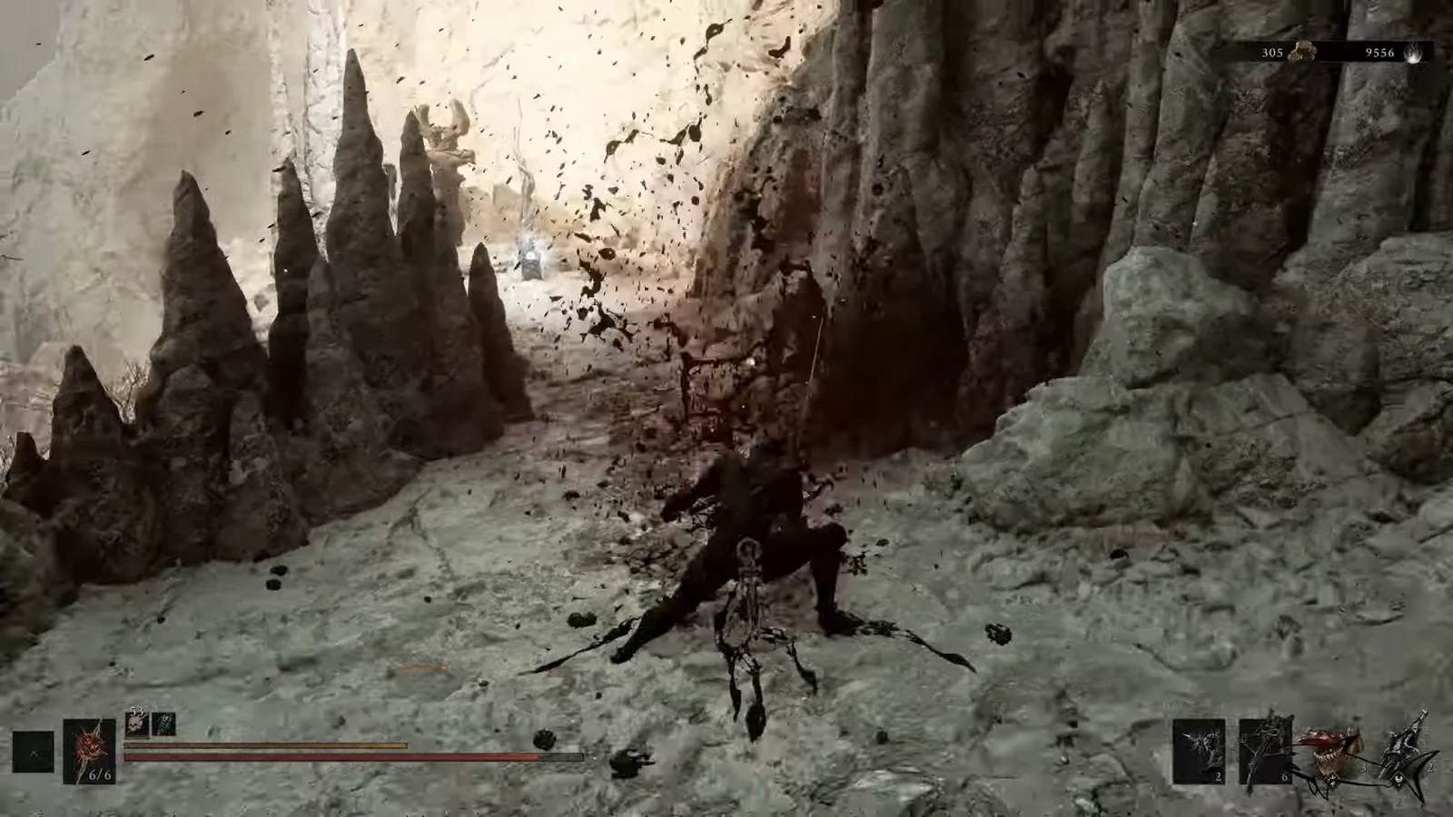 Player attacking a dark humanoid enemy inside a rocky cavern