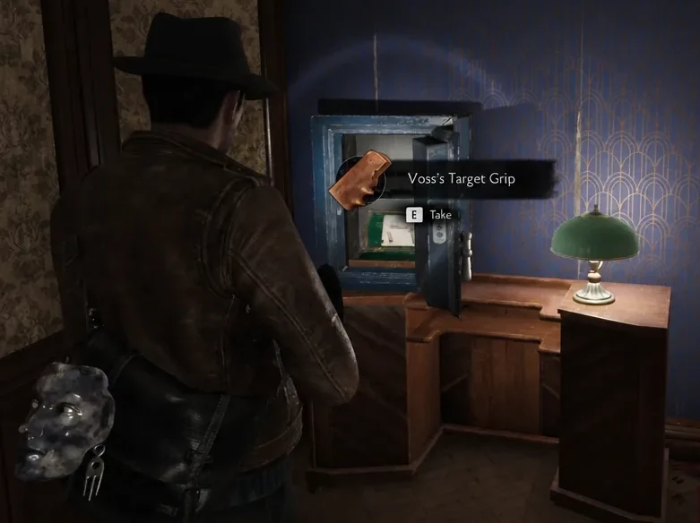 Take prompt highlighted over Voss's Target Grip sitting inside the opened safe