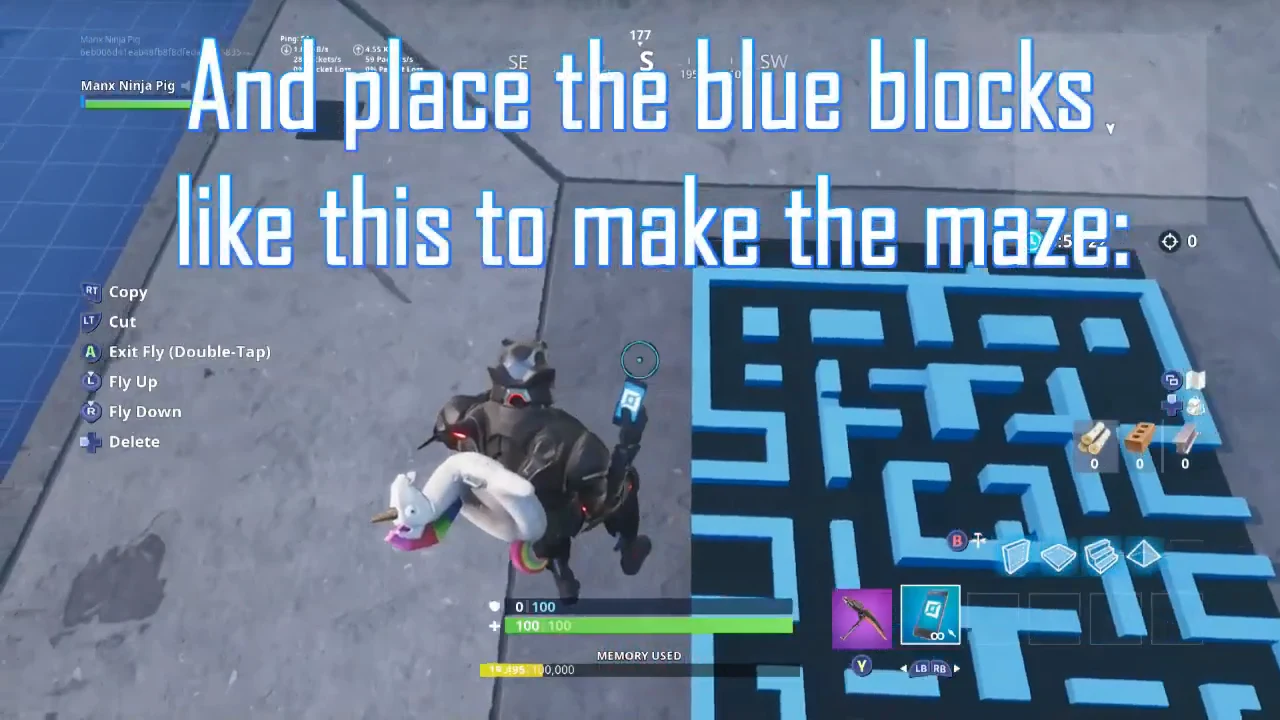 Aerial view of blue blocks being placed to form the maze walls