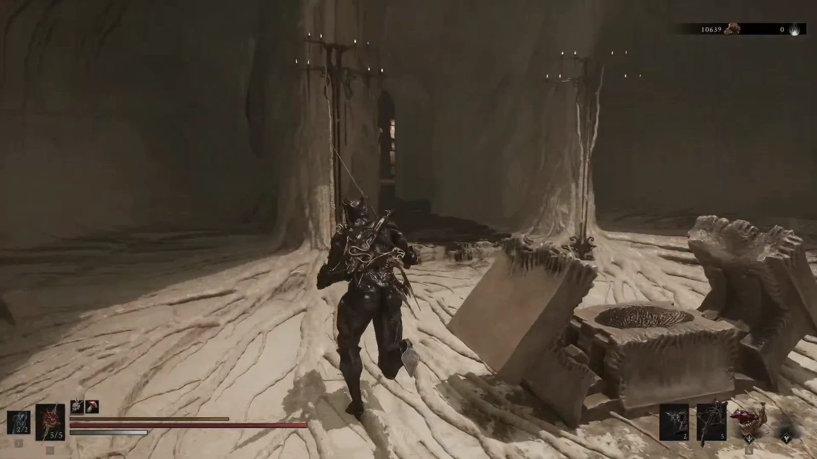 Armored character approaching a stone altar in a candlelit cavern before the lift down