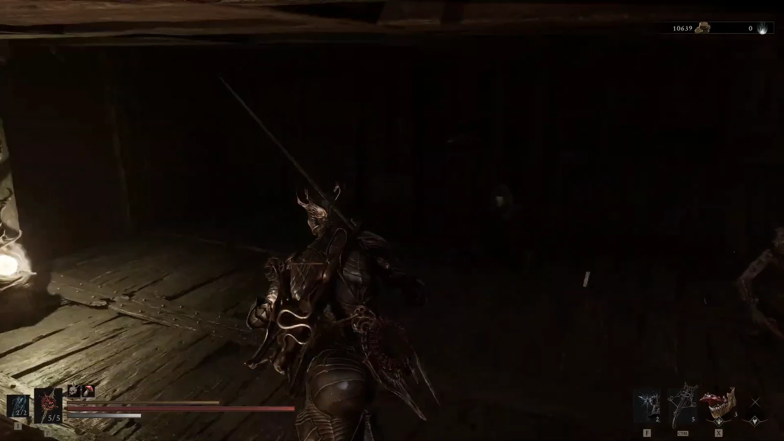 Character with a sword exploring a dark wooden room with health and resource HUD visible