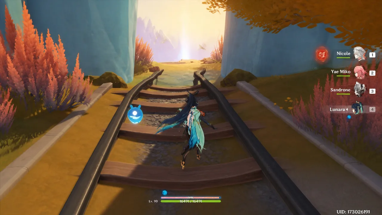 Traveler moving along railway tracks toward a sunlit canyon opening