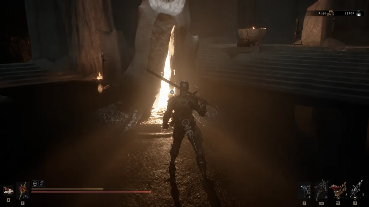 Armored player character running through a torch-lit cavern on the way to Merrick at Marrow Keep