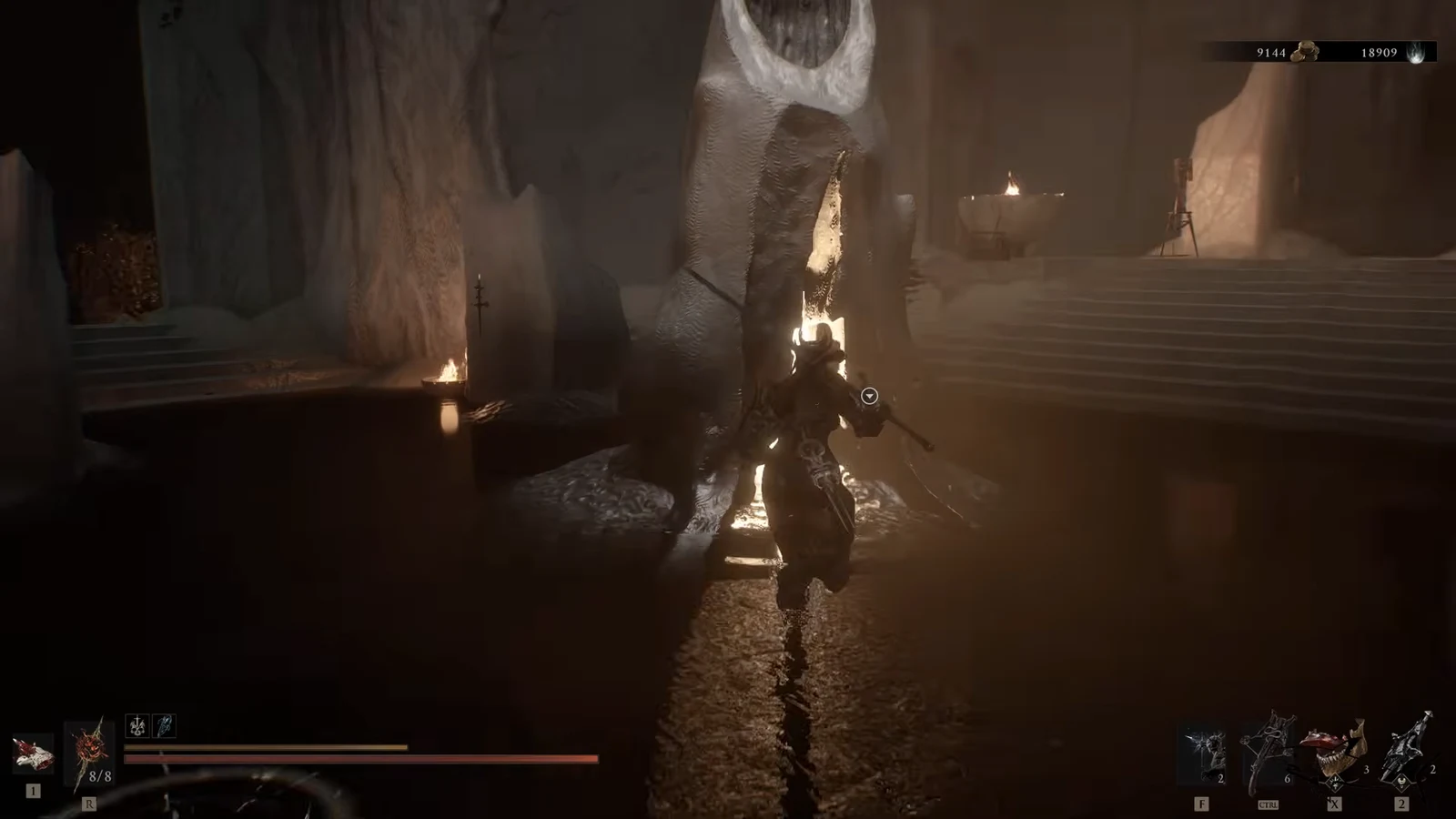 Player walking up to Merrick, marked with a round interaction prompt, inside a torchlit stone hall