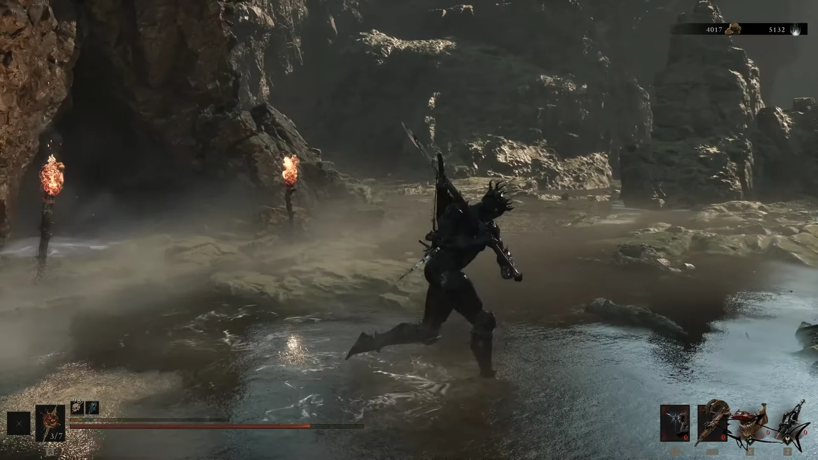 Armored character runs through shallow cave water with a weapon drawn toward the boss