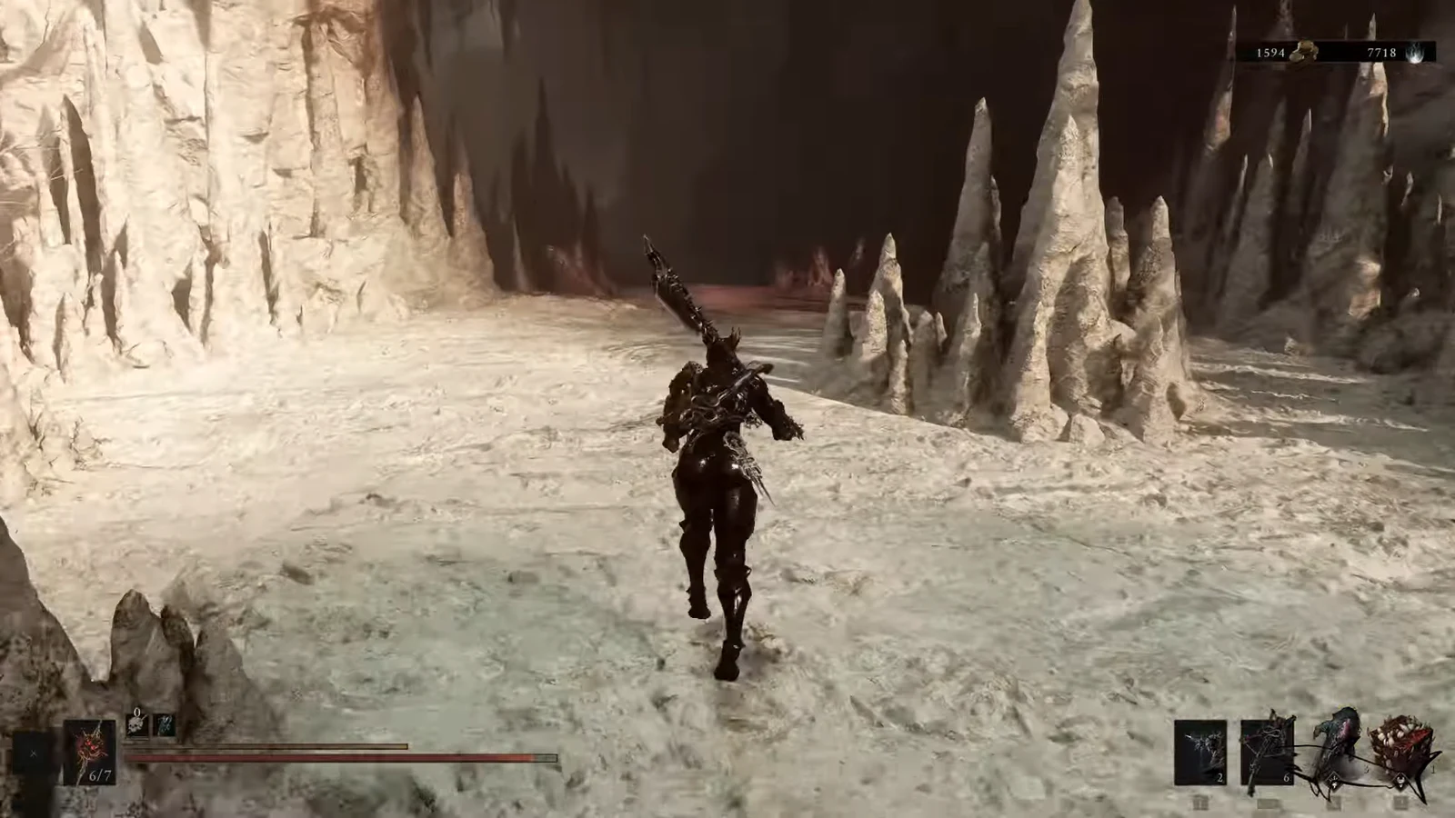 Player character running through a jagged ice cavern with a large weapon equipped