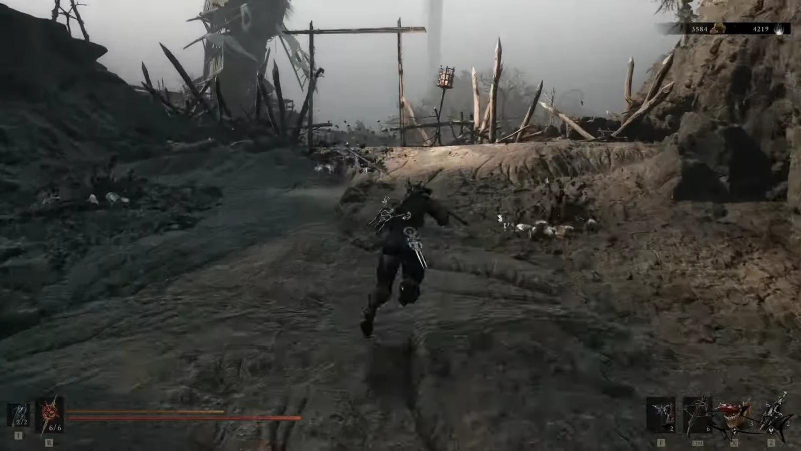 Armored character running up a muddy path toward a wooden barricade