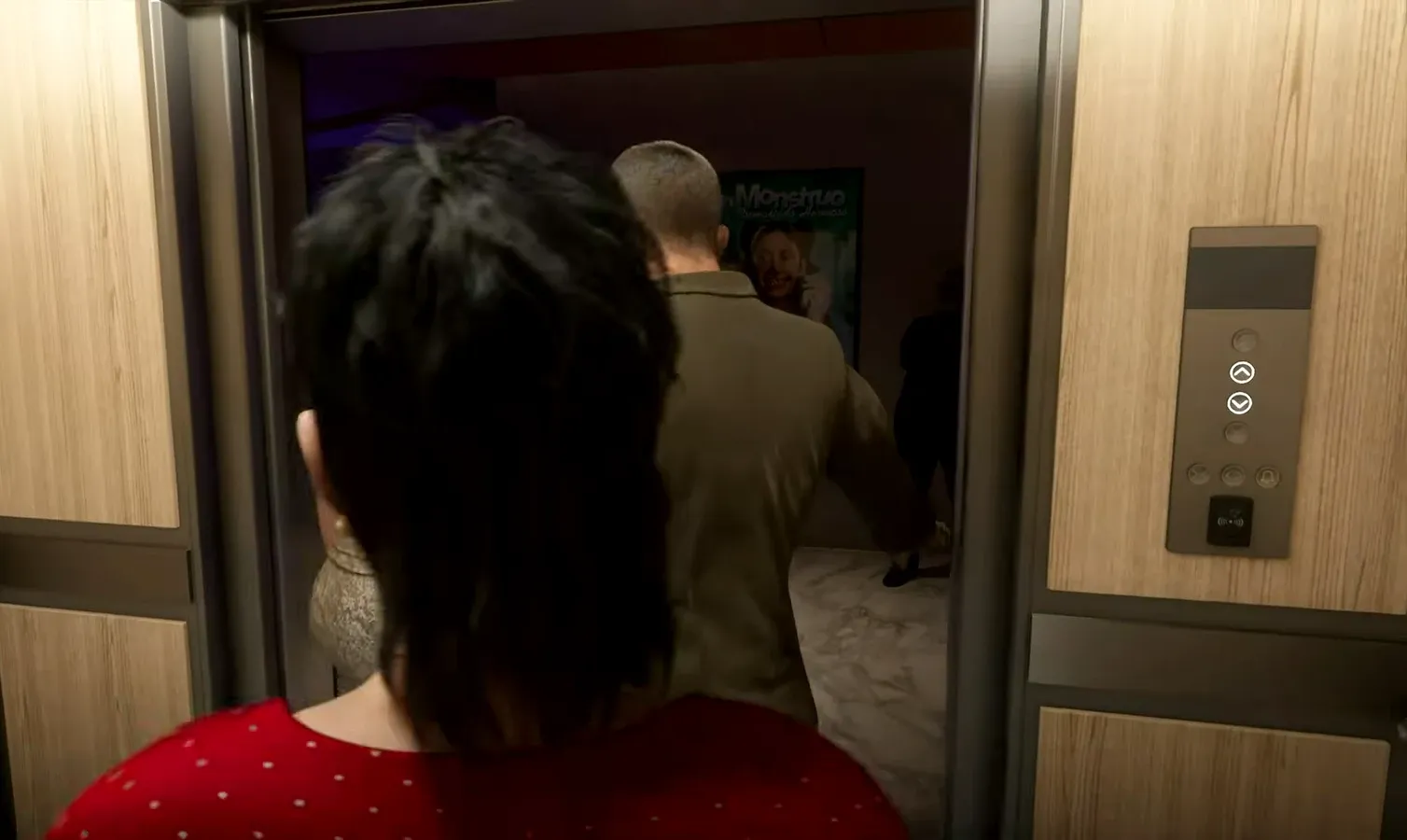 Passengers stepping into an open elevator with the up and down control buttons lit
