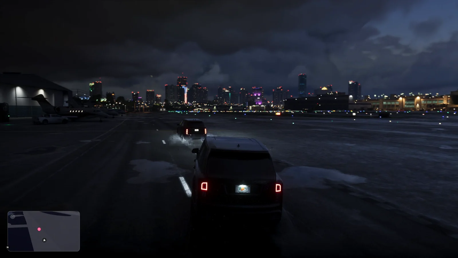 Black SUV motorcade leaving the airport at night in GTA 6