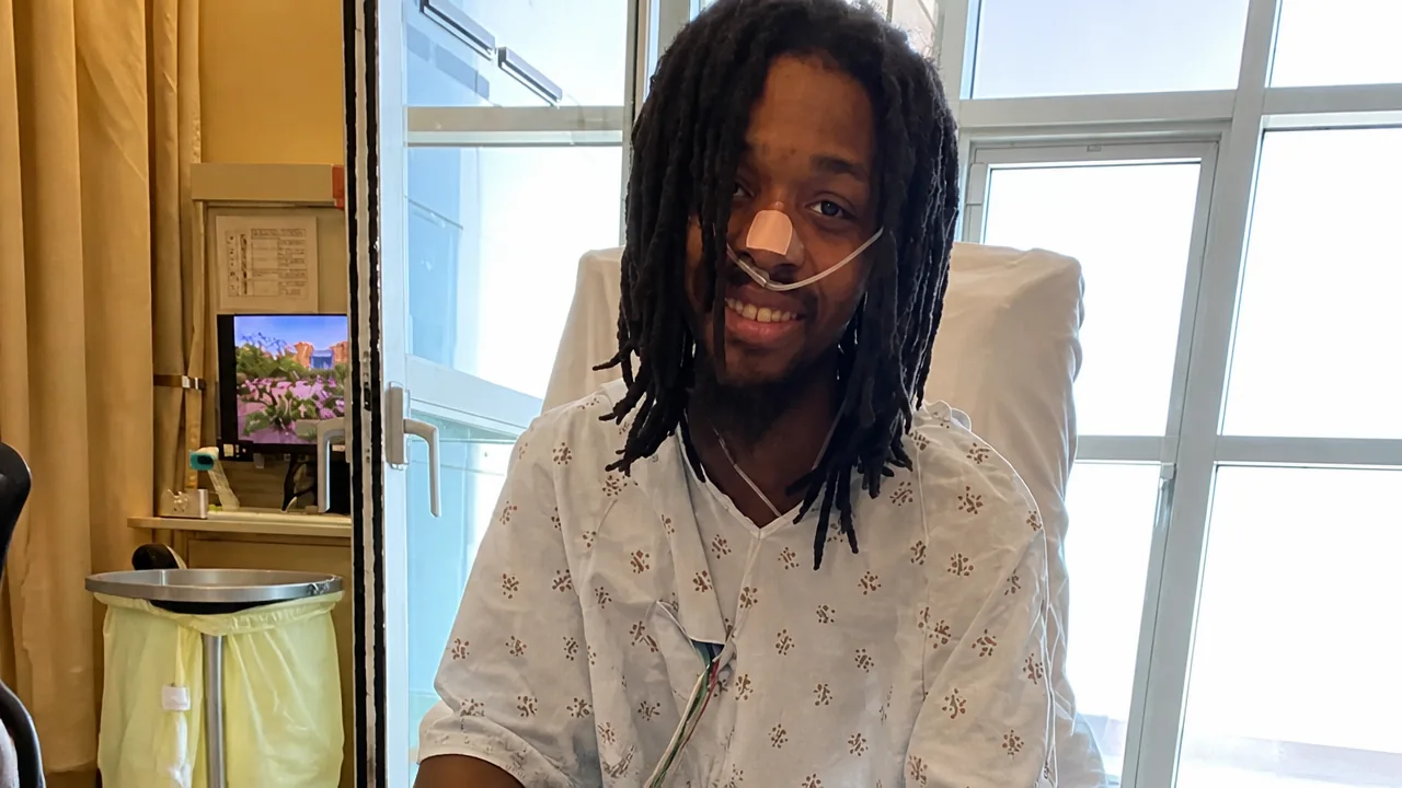 Jerry Fort wearing a hospital gown in a hospital