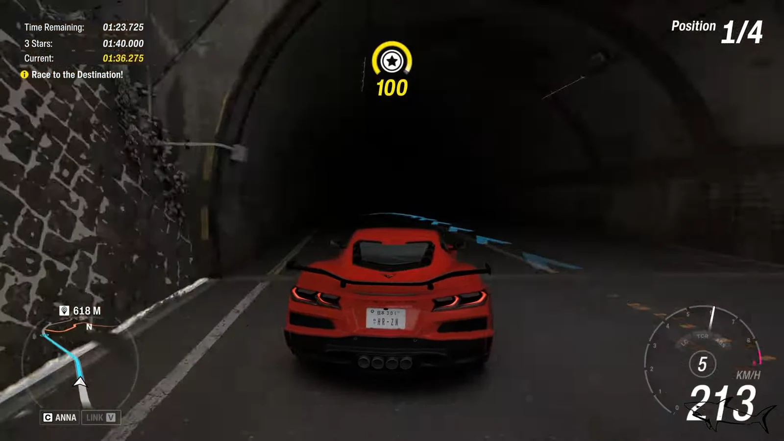 HUD showing a red sports car in first place racing through a tunnel with 618 meters left