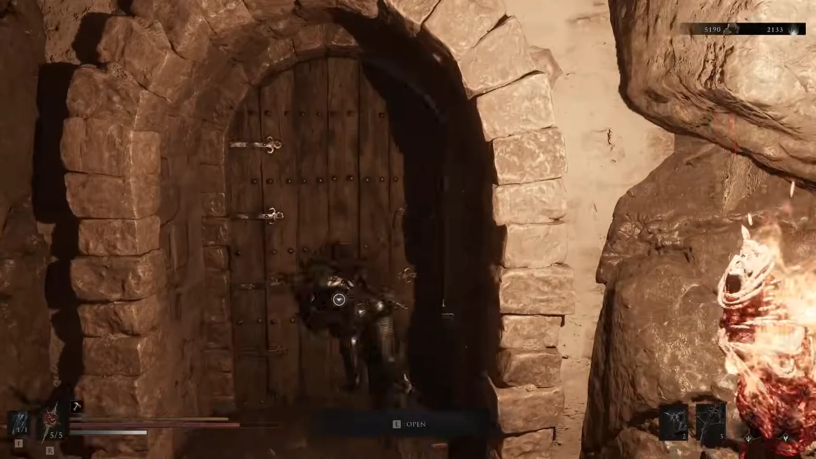 Player faces a barred wooden door with an on-screen OPEN prompt