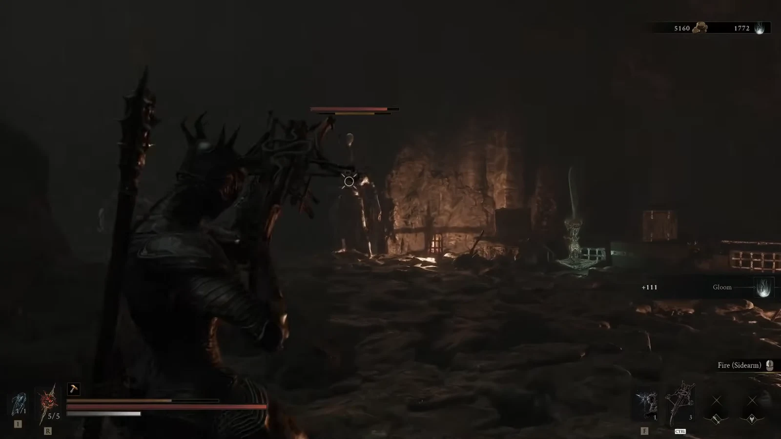 Fire (Sidearm) prompt on screen as the player aims at an enemy inside the cave arena