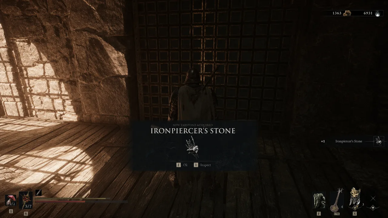 Acquisition popup showing Ironpiercer's Stone obtained with prompts to dismiss or inspect