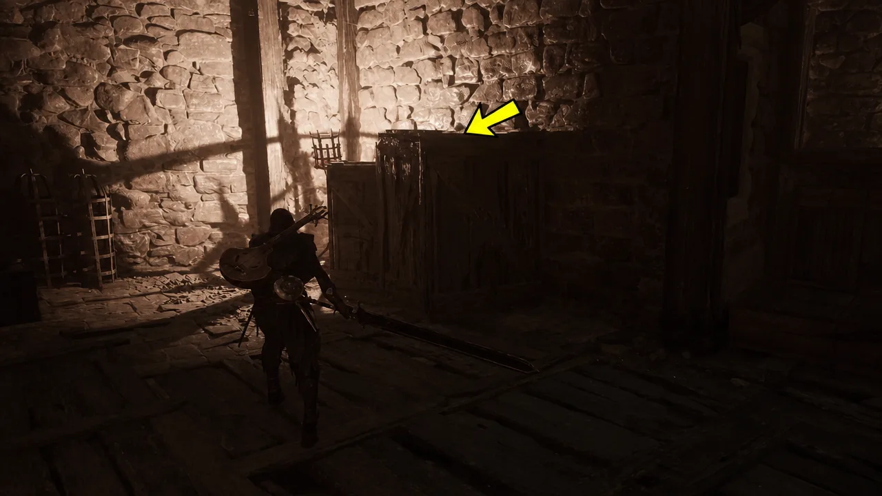 Yellow arrow pointing at the large wooden crate in the corner of the sewer room
