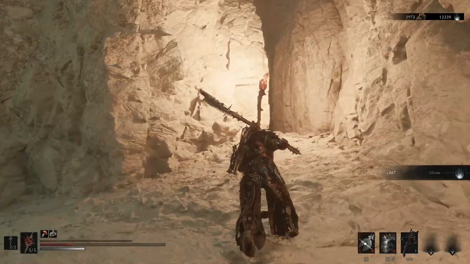Character with a large spiked weapon in the cavern as a +267 Gloom reward appears on screen