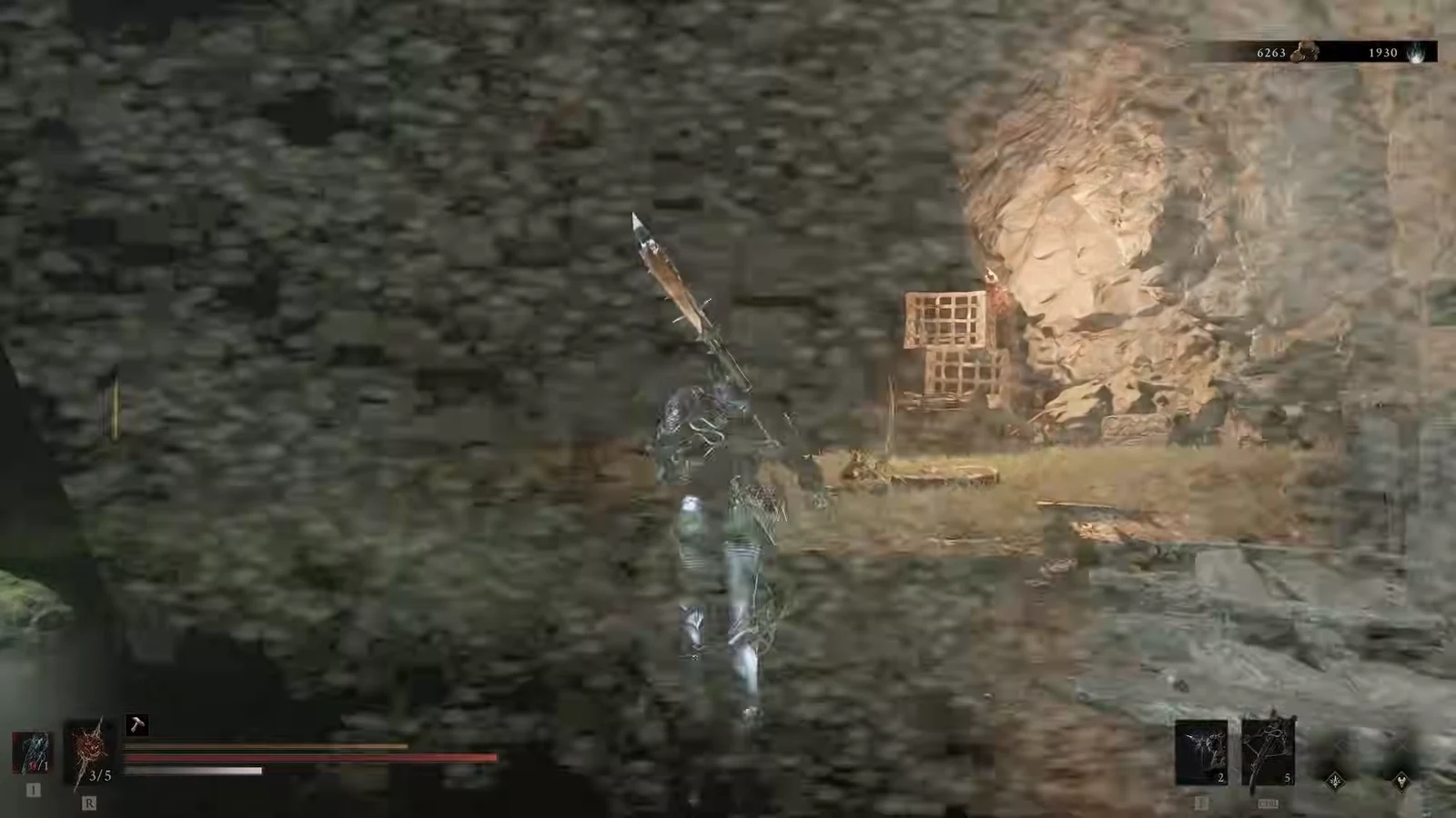 Spear-wielding character approaching a wooden cage on rocky outdoor ground