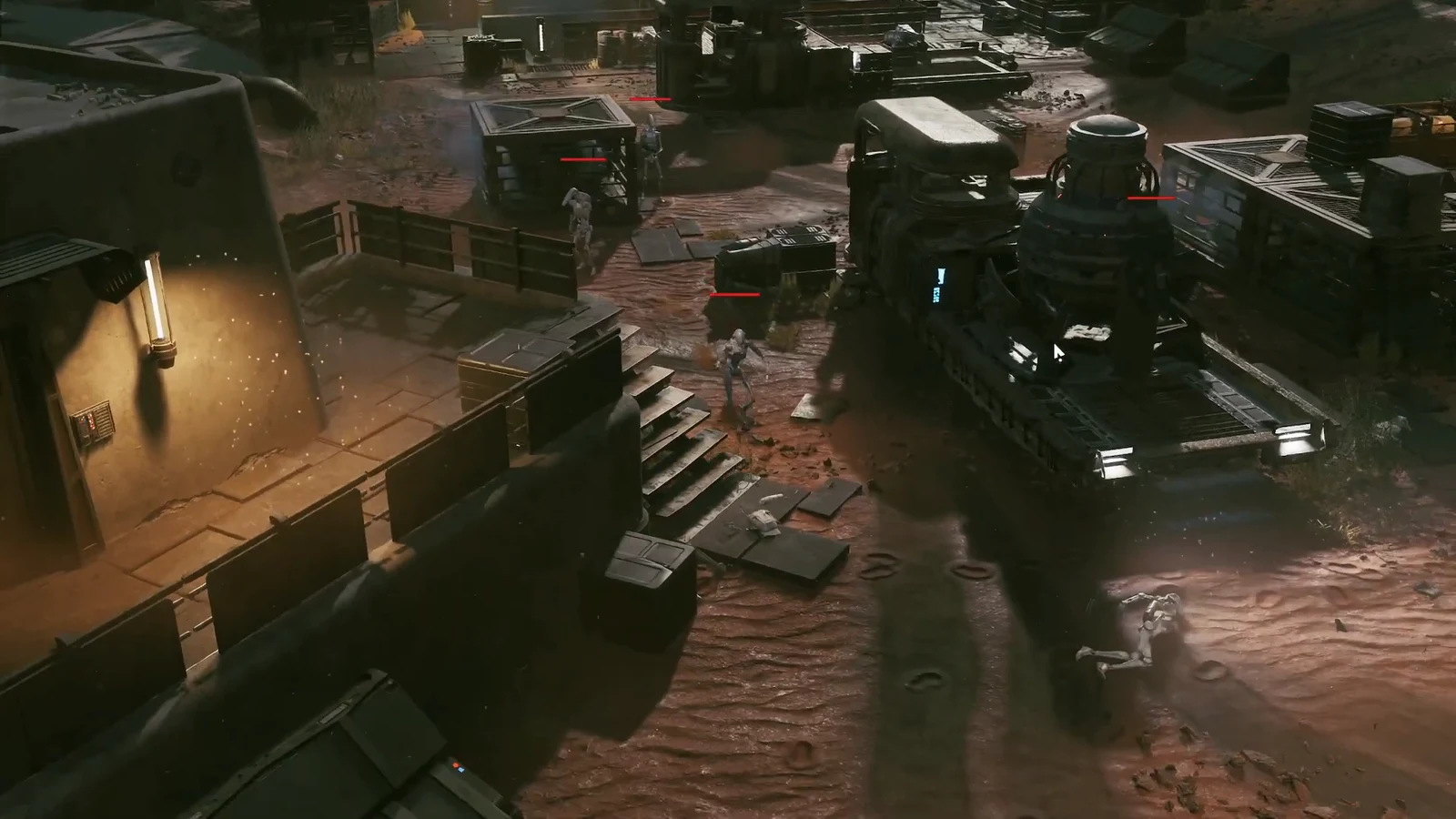 Droids with red health bars return fire across an industrial yard filled with vehicles and cargo crates