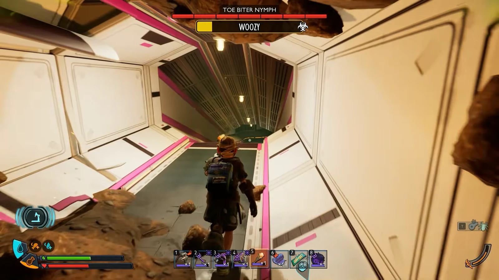 Player moves through a damaged lab corridor toward the locked door with the boss bar visible.