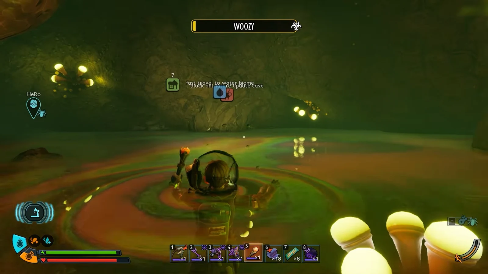 Character wades through the flooded cave with the water biome objective and hotbar on screen.