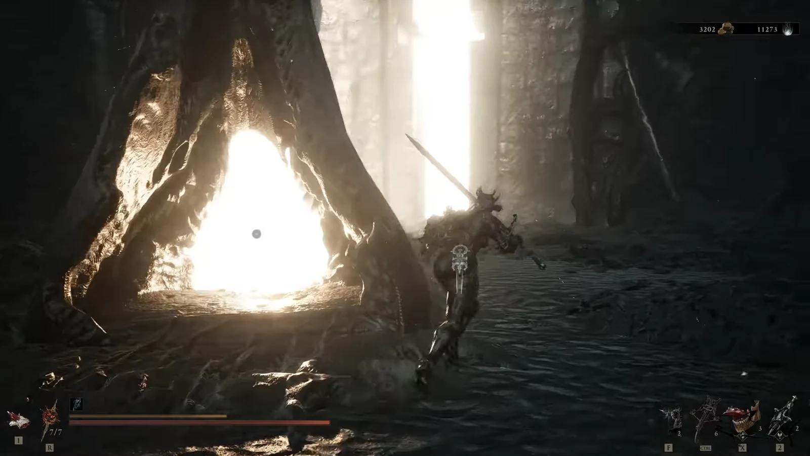 Character wading through shallow water toward a large enemy near a glowing cave mouth