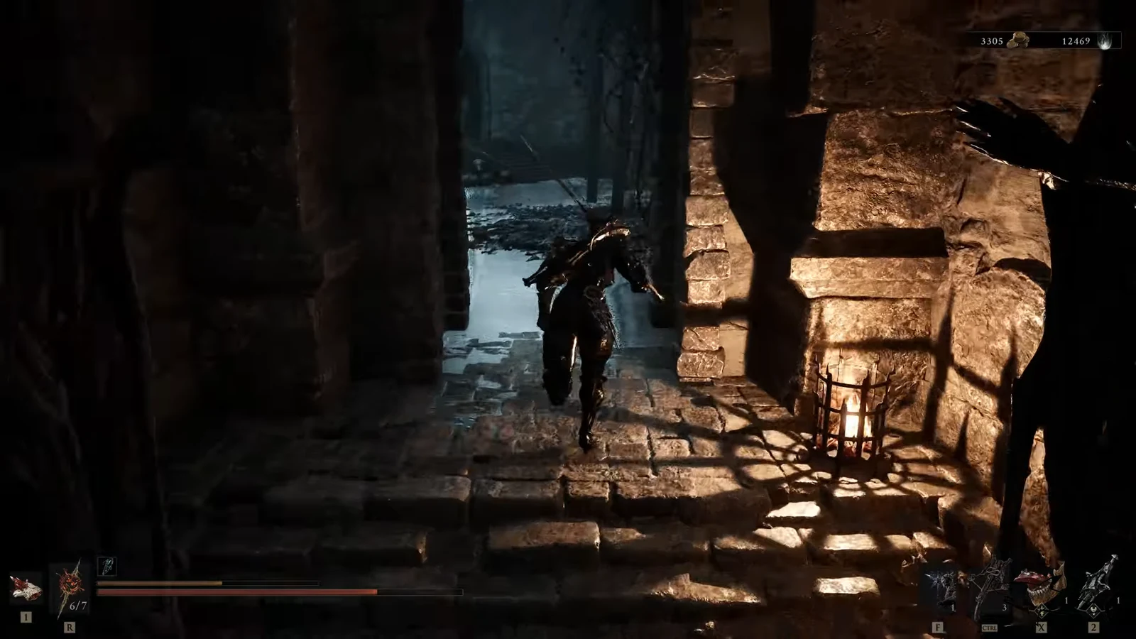 Player character walking through a torch-lit stone doorway into a dark prison corridor