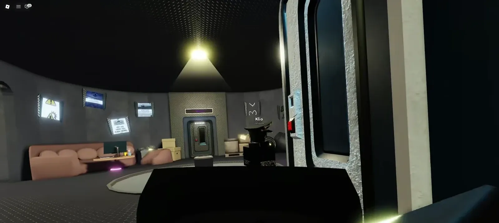 Futuristic bunker interior with a sealed central door and a surrounding lounge area