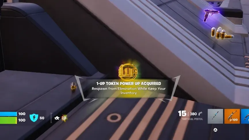 HUD banner reading 1-UP TOKEN POWER UP ACQUIRED after collecting the token