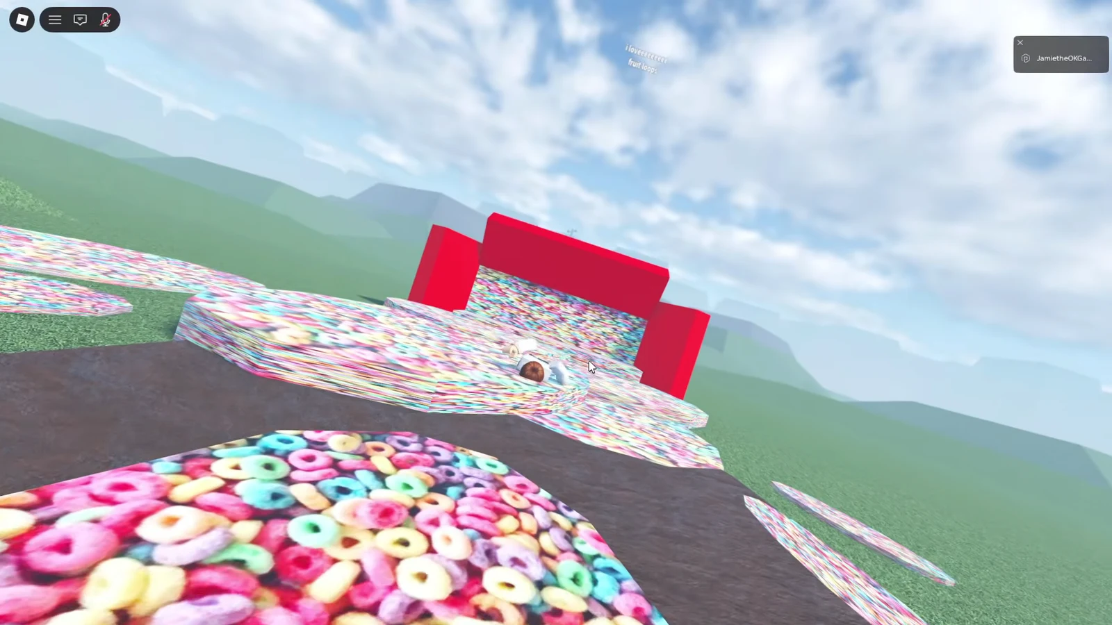 Avatar crossing a colorful cereal-themed obstacle course toward a red block structure