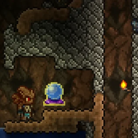 Player standing beside a placed Crystal Ball on a wooden platform in an underground cavern