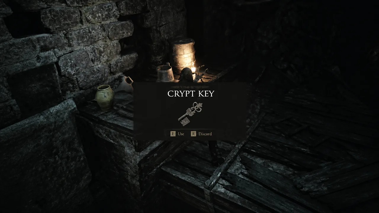 Crypt Key pickup prompt on screen with options to use or discard the item