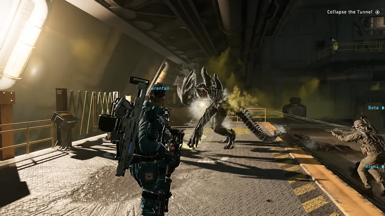 Team firing on an alien creature with the Collapse the Tunnel objective on screen