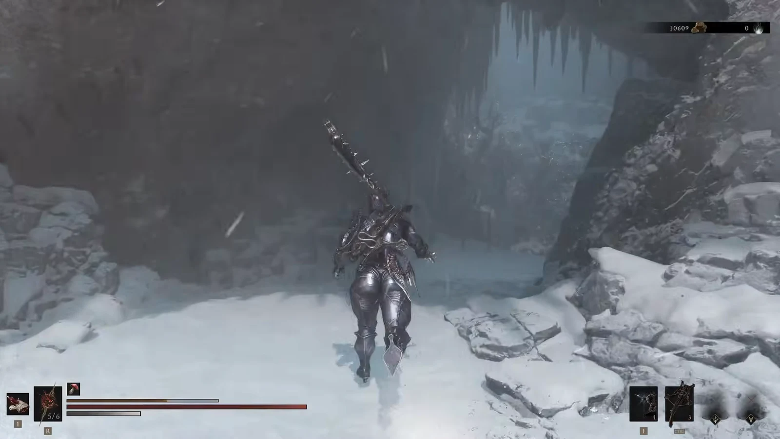 Player crosses the snowy area under the bridge with the combat HUD visible