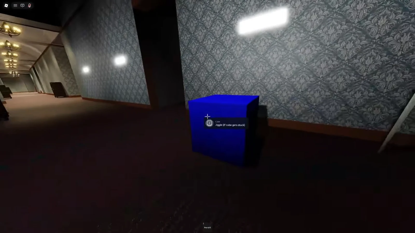 Interaction prompt on the blue Cube showing the option to jiggle it free if stuck