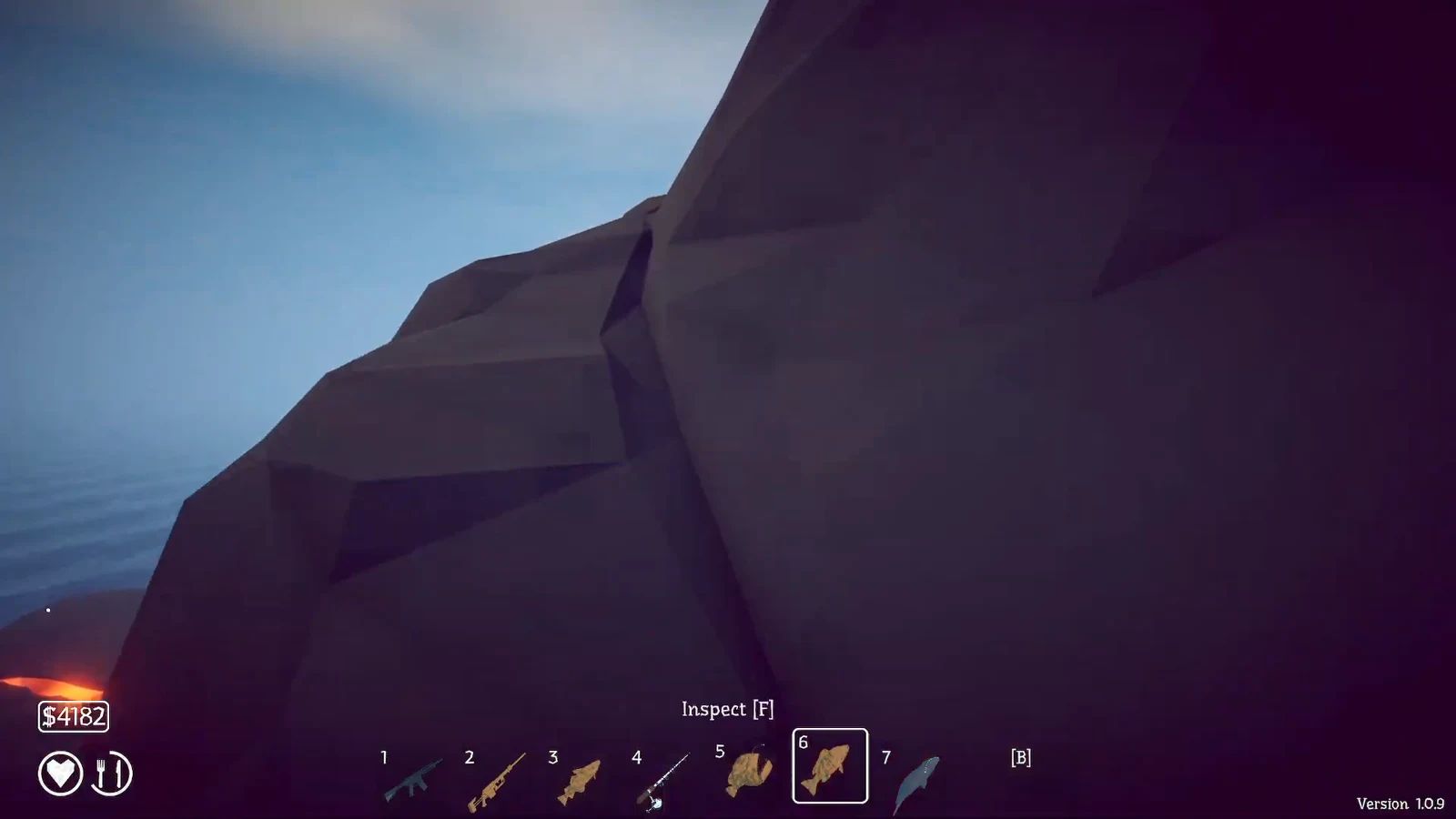 Hotbar slot six selected on a fish item with an inspect F prompt on the volcano terrain